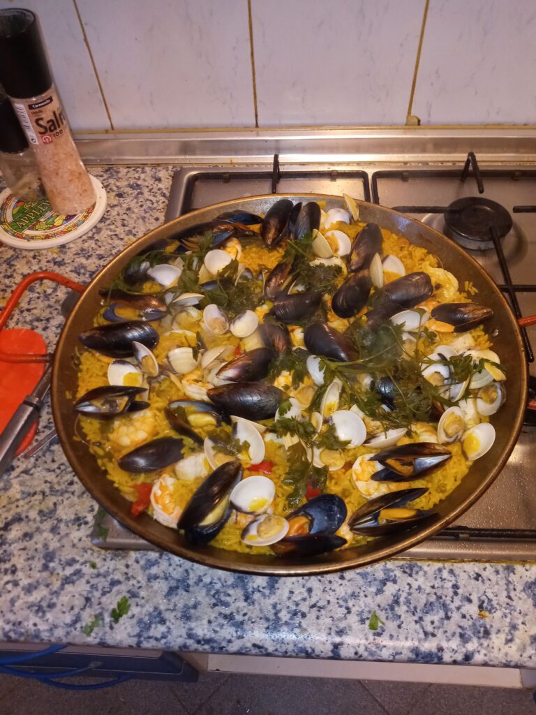 Paella de Mariscos - Paella made with fish and shellfish.