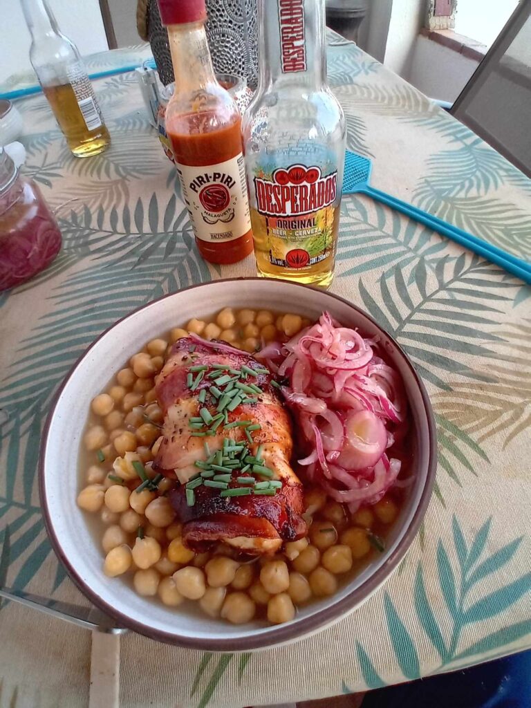 Chicken wrapped in bacon with chickpeas